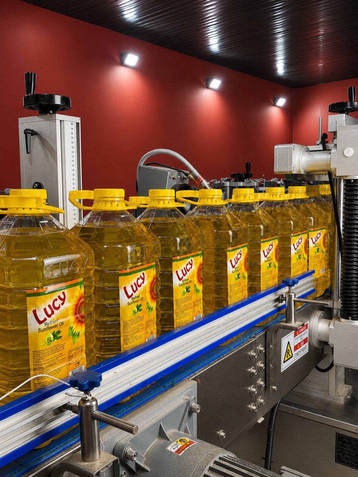 Lucy Sunflower Oil bottles moving along the filling line at the ONZ Foods factory